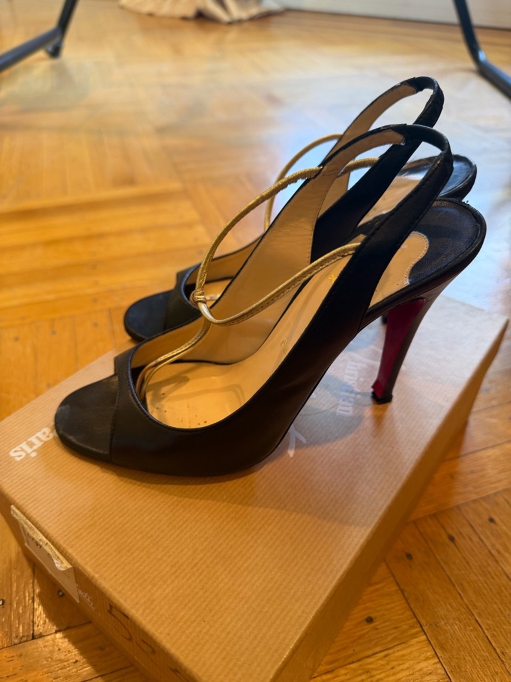 Louboutin black and gold heels